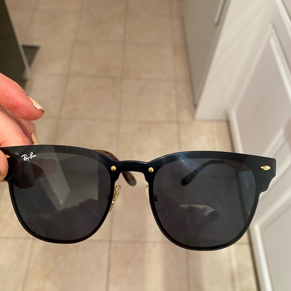 Ray-Ban sunglasses.